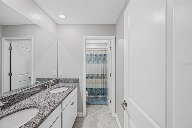 11321 Chilly Water Ct, Riverview, FL 33569 - bathroom with toilet, double vanity, tile patterned floors, curtained shower, and a textured ceiling