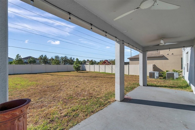 view of yard featuring central air condition unit, a patio area, and ceiling fan