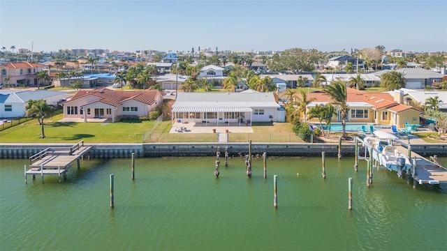 birds eye view of property with a water view