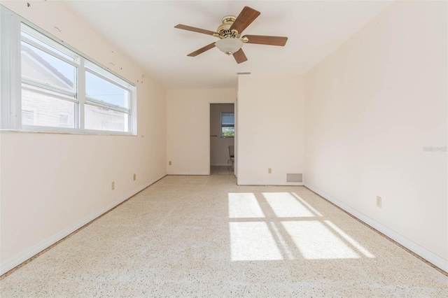 empty room featuring ceiling fan