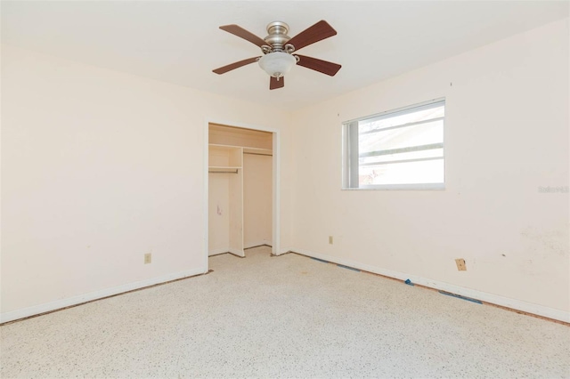 unfurnished bedroom featuring ceiling fan and a closet