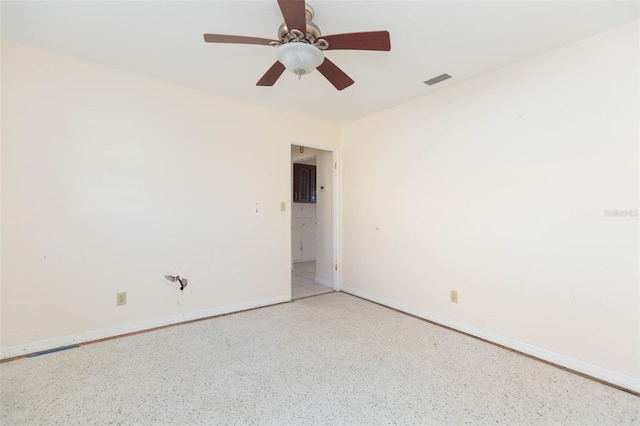 spare room with ceiling fan