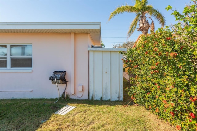 view of side of home featuring a yard