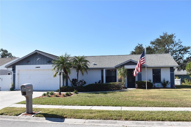 ranch-style house with a garage and a front lawn