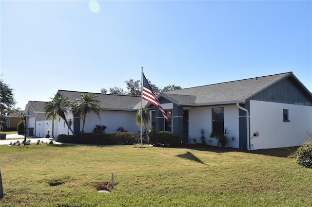 single story home with a front lawn