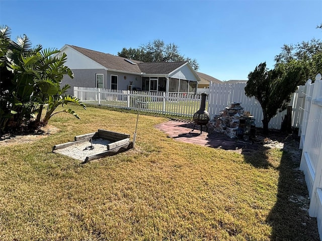 view of yard with a sunroom