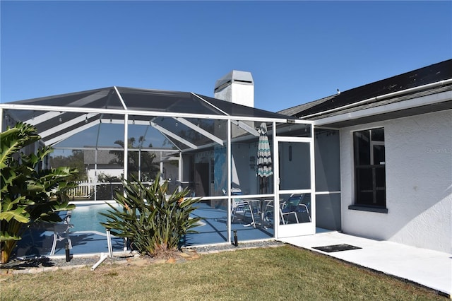 rear view of house with a lanai