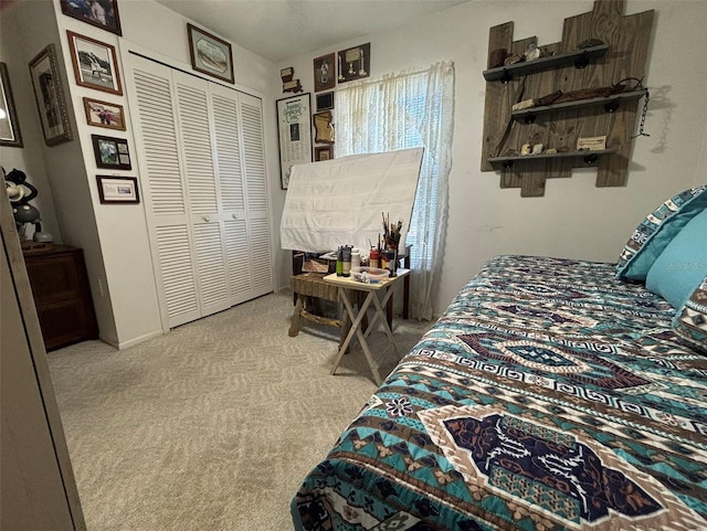 bedroom with light colored carpet and a closet