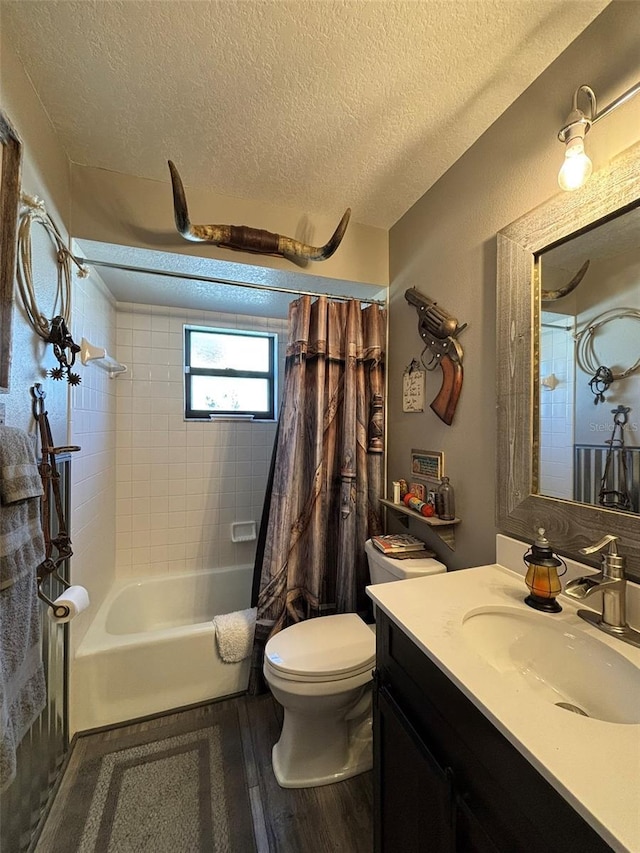 full bathroom with shower / bath combination with curtain, vanity, a textured ceiling, wood-type flooring, and toilet