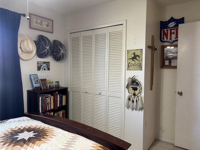 bedroom with carpet flooring and a closet