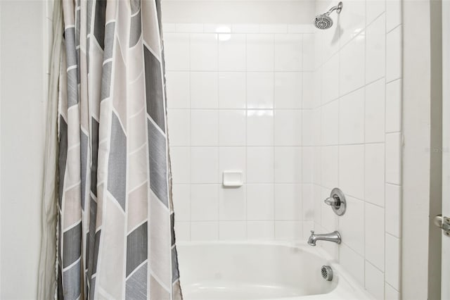 bathroom with shower / tub combo with curtain