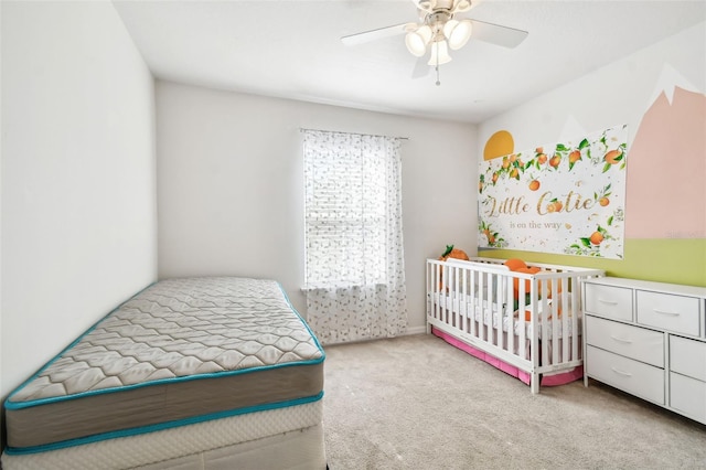 bedroom with light carpet and ceiling fan