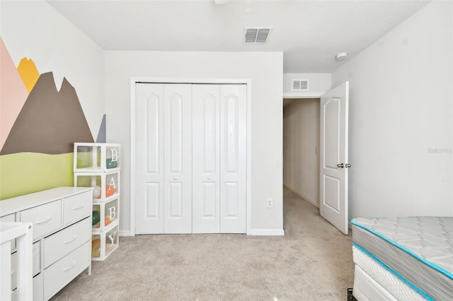 carpeted bedroom featuring a closet