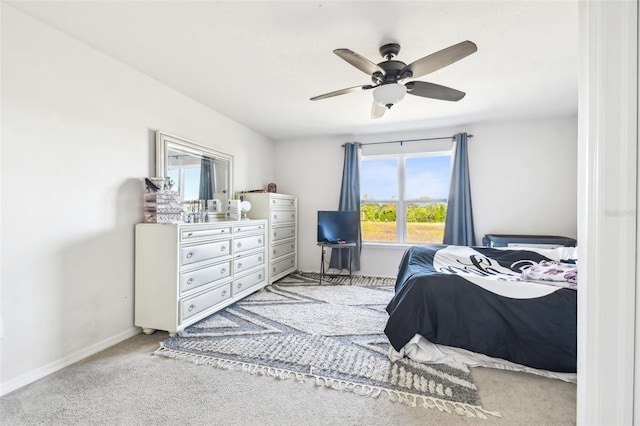 bedroom with light carpet and ceiling fan