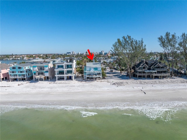 aerial view featuring a view of the beach and a water view