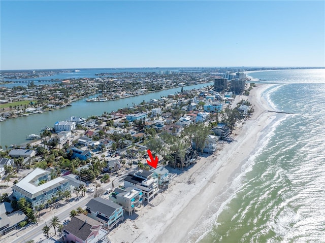 drone / aerial view with a water view and a beach view