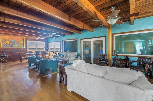 living room featuring beamed ceiling, wooden ceiling, and hardwood / wood-style flooring