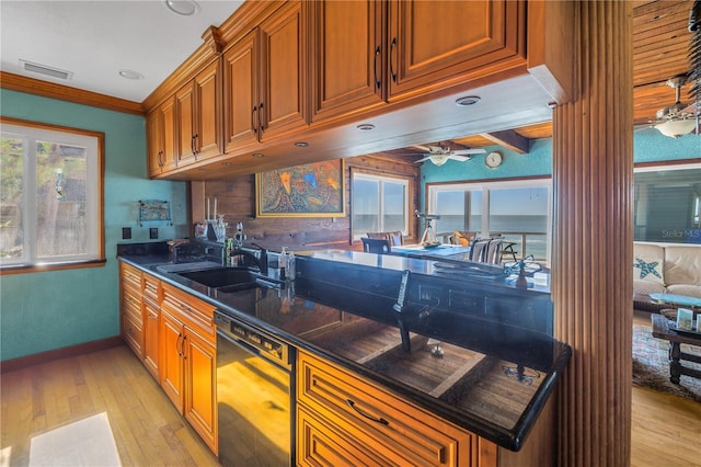 kitchen featuring beam ceiling, ceiling fan, sink, dishwasher, and light wood-type flooring