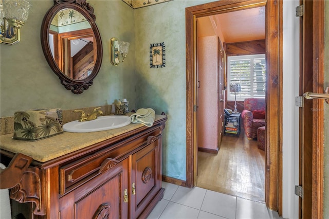 bathroom featuring hardwood / wood-style flooring and vanity