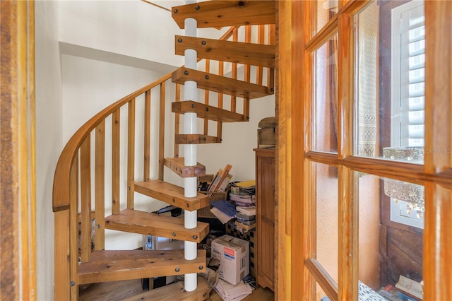 stairway featuring hardwood / wood-style flooring