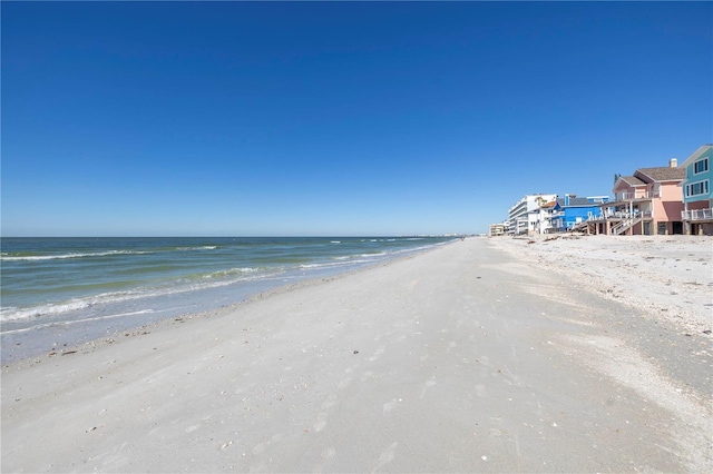 property view of water featuring a beach view