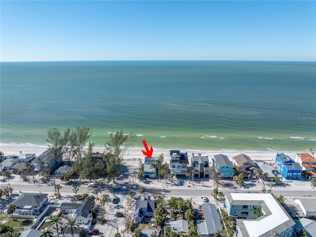 aerial view with a water view and a beach view