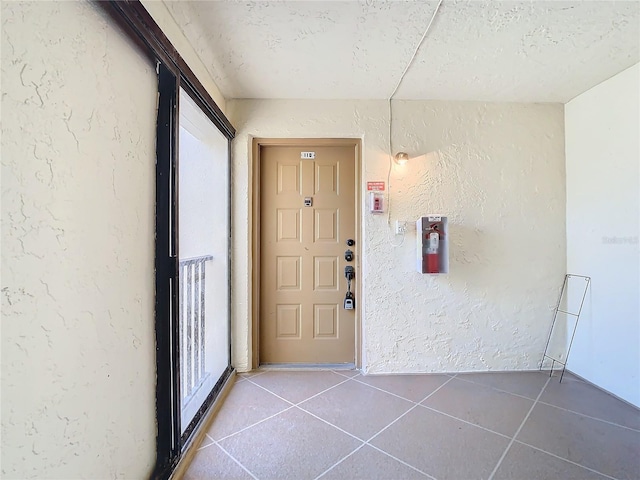 doorway to property with tile patterned floors