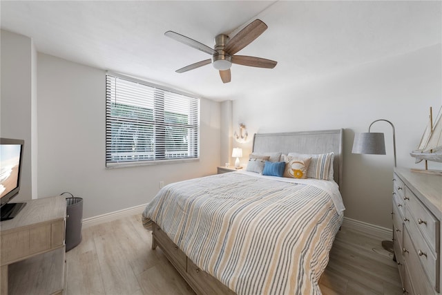 bedroom featuring ceiling fan and light hardwood / wood-style flooring