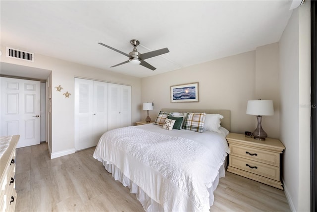 bedroom featuring ceiling fan, a closet, and light hardwood / wood-style floors