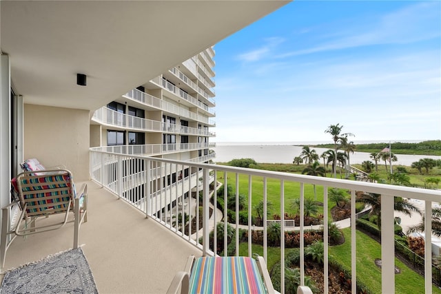 balcony featuring a water view