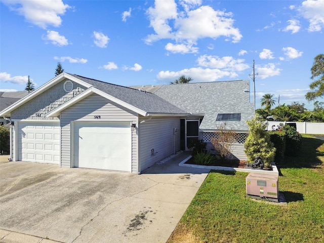 single story home with a front lawn and a garage