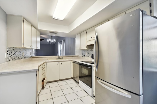 kitchen featuring kitchen peninsula, backsplash, stainless steel appliances, sink, and light tile patterned flooring