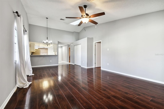 unfurnished living room featuring a textured ceiling, ceiling fan with notable chandelier, dark wood-type flooring, and high vaulted ceiling