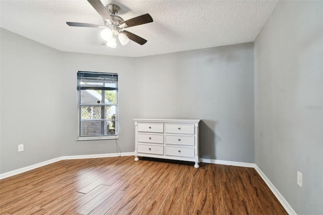 unfurnished bedroom with ceiling fan, wood-type flooring, and a textured ceiling