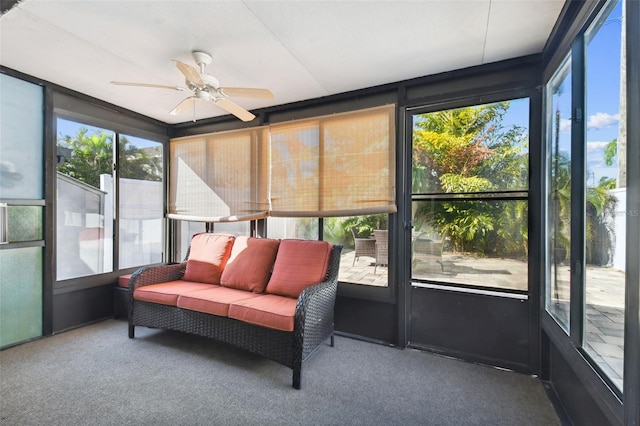 sunroom / solarium featuring ceiling fan