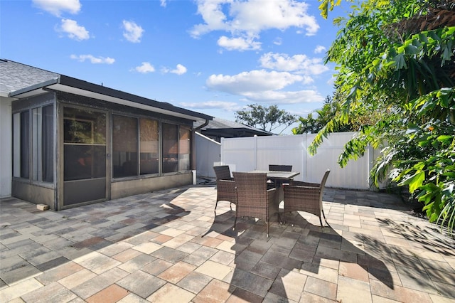 view of patio / terrace with a sunroom