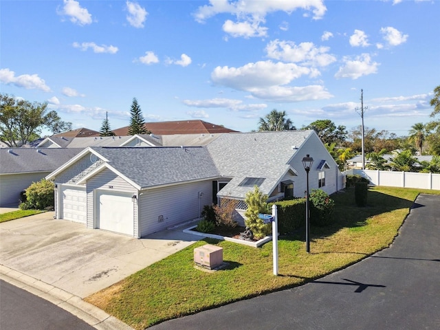 single story home with a garage and a front yard