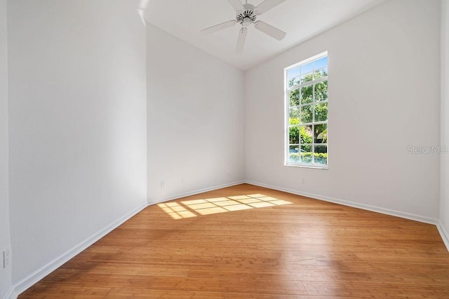 empty room with ceiling fan and light wood-type flooring