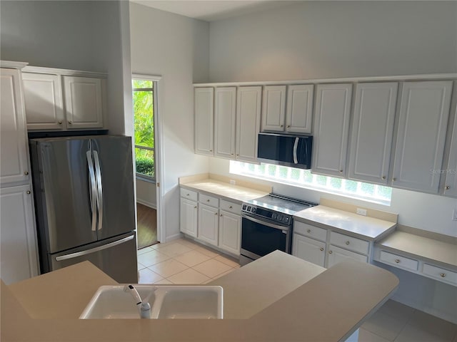 kitchen with white cabinetry, sink, a healthy amount of sunlight, and appliances with stainless steel finishes