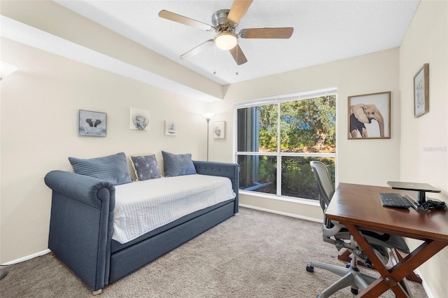 interior space featuring ceiling fan and carpet flooring