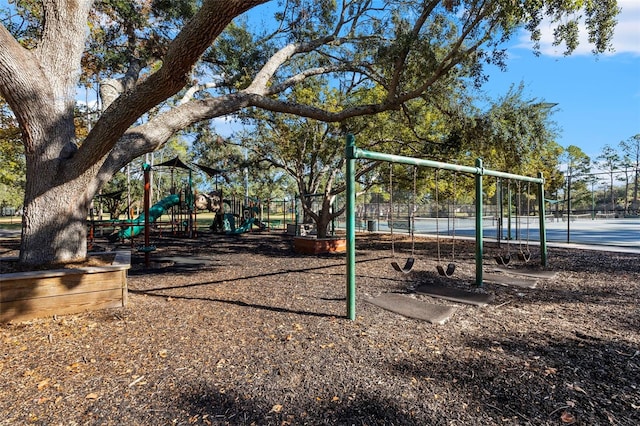 view of playground featuring tennis court