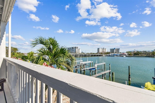 exterior space with a water view and a dock