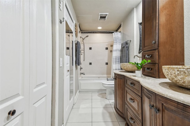 full bathroom with tile patterned flooring, shower / bath combo, vanity, and toilet