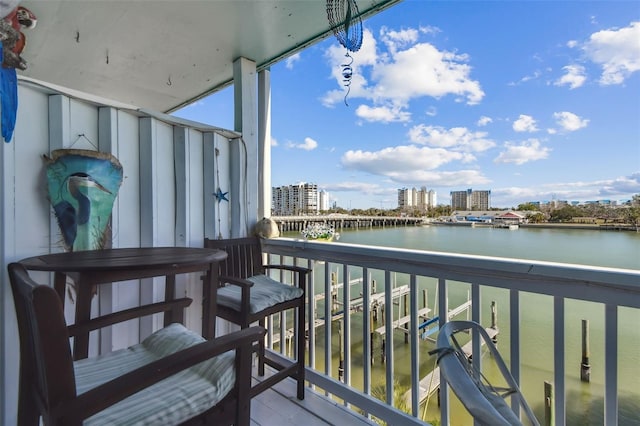 balcony featuring a water view