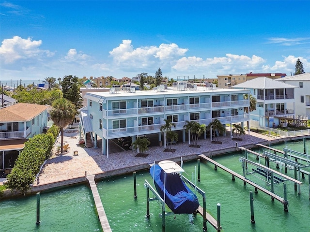 143 94th Ave Unit 2, Treasure Island, FL 33706 - view of swimming pool with a water view and a boat dock