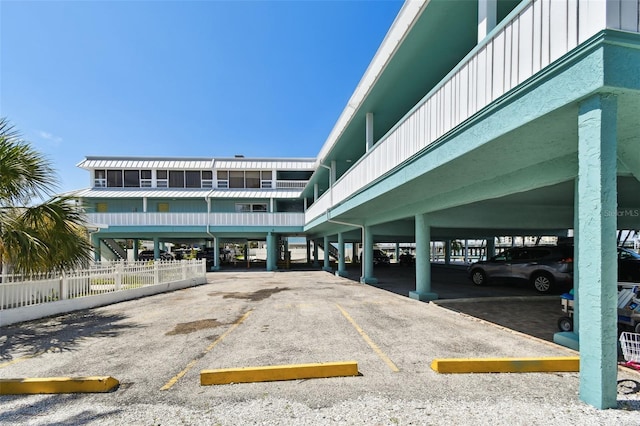 143 94th Ave Unit 2, Treasure Island, FL 33706 - view of building exterior featuring covered and uncovered parking