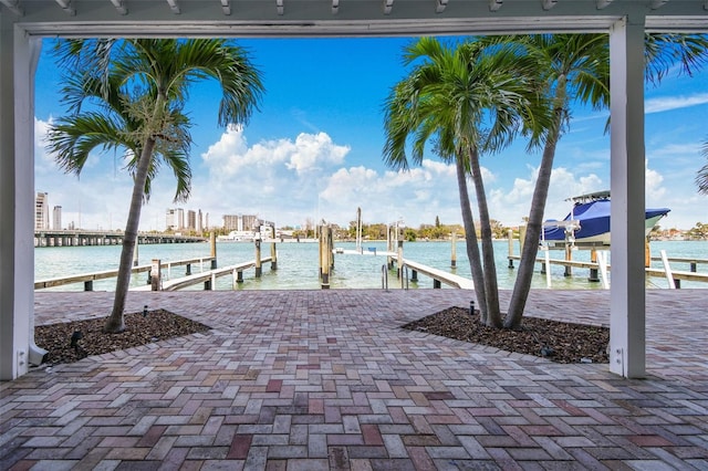 143 94th Ave Unit 2, Treasure Island, FL 33706 - dock area featuring boat lift and a water view