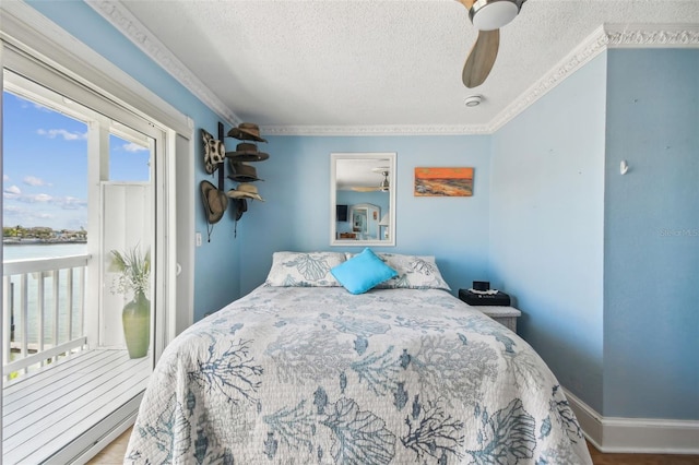 143 94th Ave Unit 2, Treasure Island, FL 33706 - bedroom featuring a textured ceiling, ceiling fan, a water view, ornamental molding, and wood finished floors