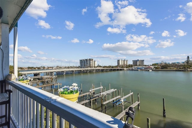 143 94th Ave Unit 2, Treasure Island, FL 33706 - balcony featuring a water view, boat lift, and a dock