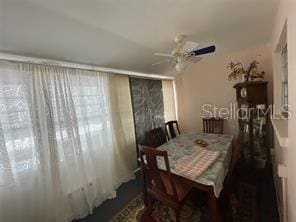 dining space with ceiling fan